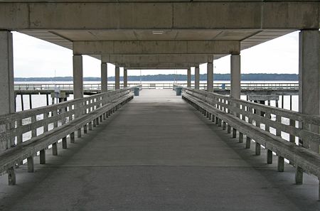 Empty Fishing pier on coast during the winterの写真素材