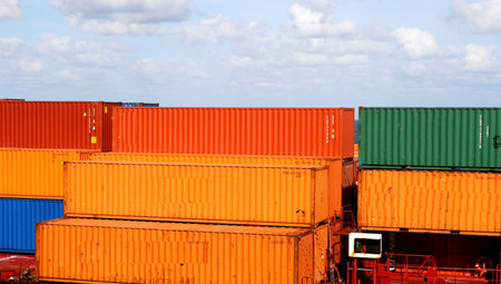 Colorful shipping containers waiting to be loaded at dock
