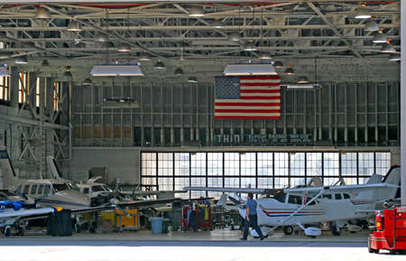 Working aircraft hanger in a busy small airportの写真素材