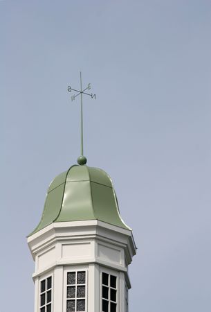 Green dome on a cupola against blue skyの写真素材