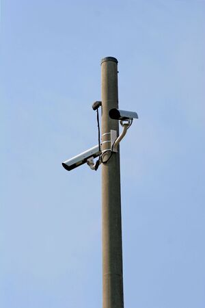 A set of traffic cameras on an interstate freewayの写真素材