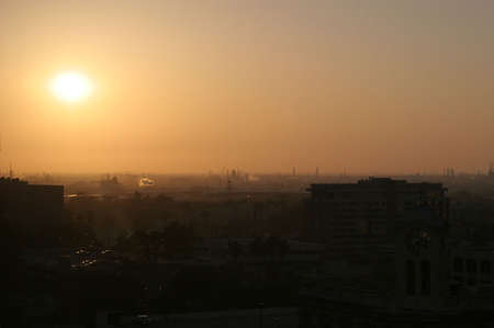 A sunrise through the smog of south LA suburbの写真素材