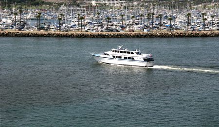 White Cabin Cruiser pulling into the bayの写真素材