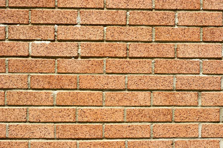 A textured wire cut brick wall for backgroundsの写真素材
