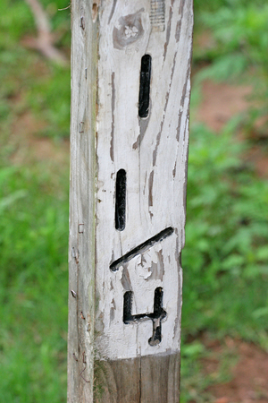 An old wooden mile marker at one and a quarter milesの写真素材