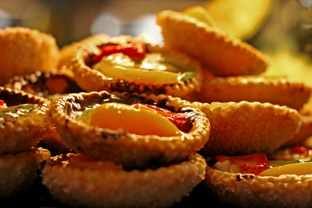 Fresh backed fruit tarts displayed at a pastry shop