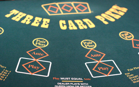 Close up of a green felt gambling table for three card poker at a casino