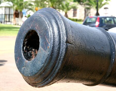 The muzzle of an antique cannon in a public parkの写真素材