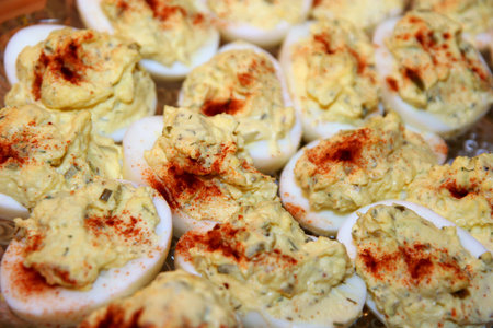 A colorful  tray of seasoned deviled eggs