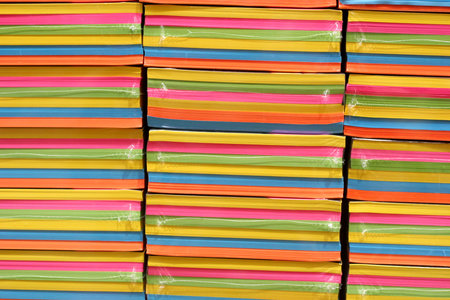 Stacks of multi-colored paper pads in a retail store