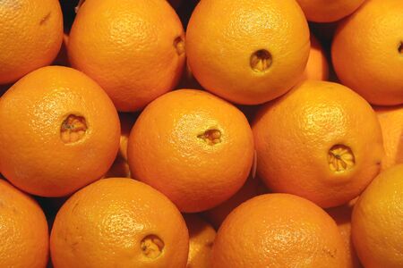 Fresh naval oranges in a fruit marketの写真素材