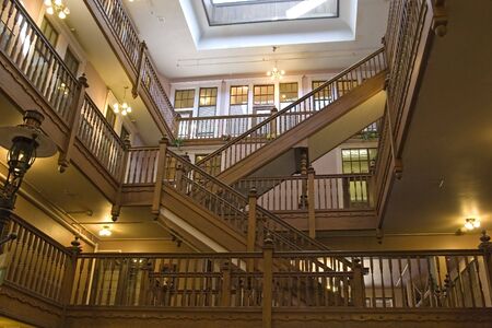 Interior shot of open retail area with many old wooden staircasesの写真素材