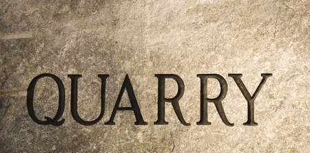 A slab of granite with the word quarry carved into itの写真素材
