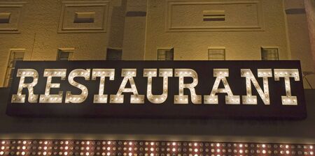 An old fashioned restaurant sign made of light bulbsの写真素材