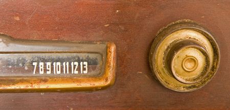 An old television set with knob and dialの写真素材