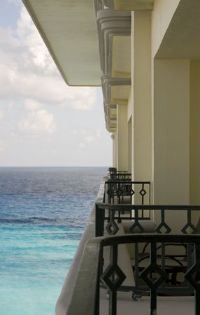 A row of balconies at a hotel descending out to seaの写真素材