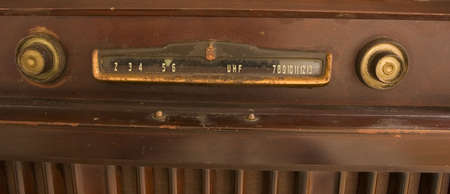 Knobs and dials on an old vintage antique television setの写真素材