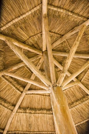A straw and timber thatched roof on a beach hutの写真素材