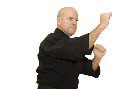 A black belt martial artist in a fighting stanceの写真素材