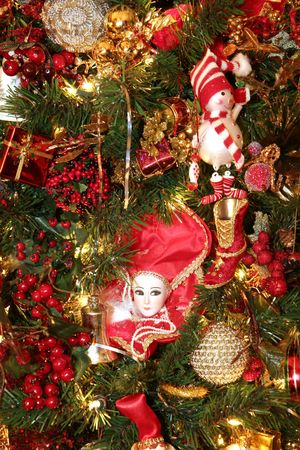 Custom christmas ornaments of snowmen and angels on a nice treeの写真素材