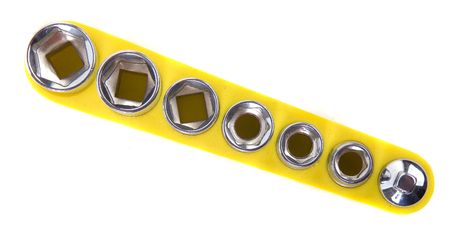 A set of sockets in a yellow holder isolated on whiteの写真素材