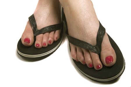 A woman with a fresh pedicure in cheap rubber sandlesの写真素材