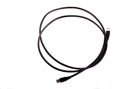 A black coiled usb cable on a white backgroundの写真素材
