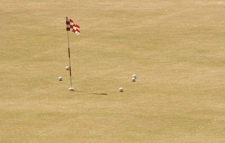 A practice putting green at a public golf courseの写真素材