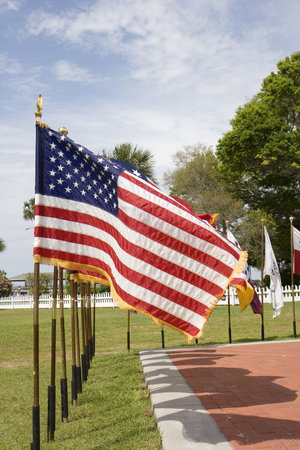 A line of historic flags at a public display