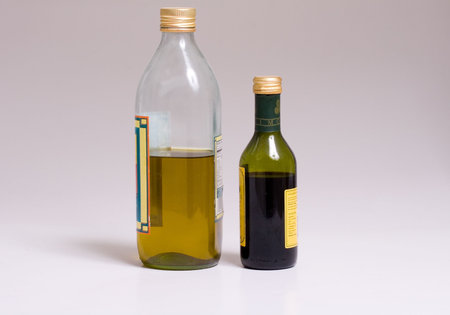 Bottles of oil and vinegar on a grey backgroundの写真素材