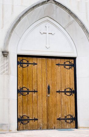 Old wooden doors to a presbyterian churchの写真素材