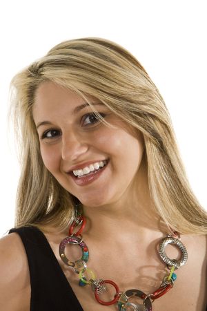 A blonde wearing a fashion necklace and a big smileの写真素材