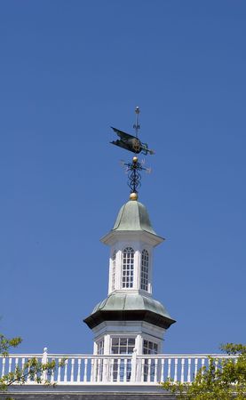 A weather vane on a traditional cupolaの写真素材
