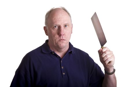 A mean old bald guy threatening with a kitchen cleaverの写真素材