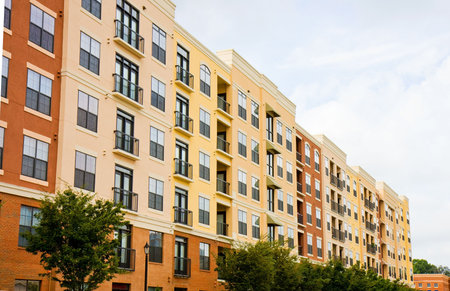 A modern condo building of yellow and brown