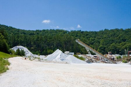 A large granite gravel mining operation in the mountainsの写真素材