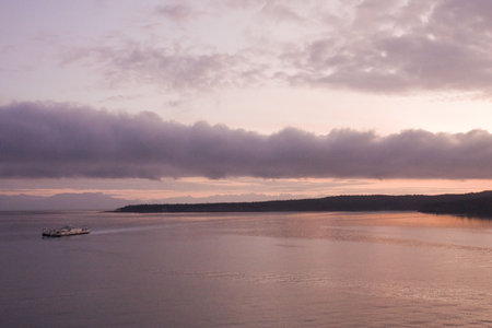 A ferry boat crossing the bay at dawn