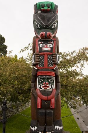 A colorful totem pole in a native american parkの写真素材