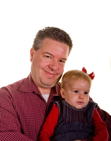 A father proudly holding his young daughterの写真素材