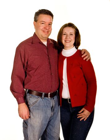 A young couple holding each other on white backgroundの写真素材