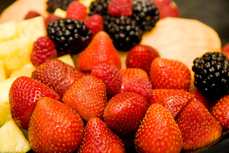 Fresh cut fruit and berries on a tray