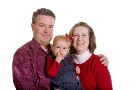 A young couple with a baby with her finger in her noseの写真素材