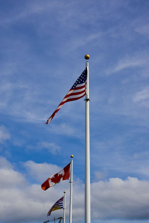 A row of three flags in British Columbia, Canada