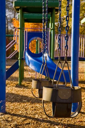 Colorful Playground Equipment in a park during Autumnの写真素材