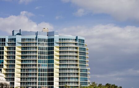 A blue and white hotel on the coastの写真素材