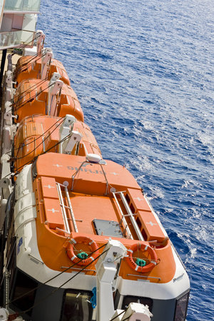 View of the side of a cruise ship showing life raftsの写真素材
