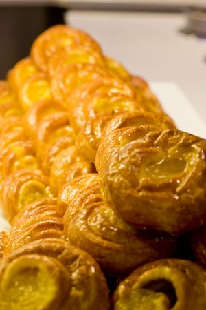 Fresh delicious pineapple pastries at a market or buffetの写真素材