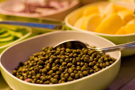 Capers and lemon and condiments for smoked salmonの写真素材