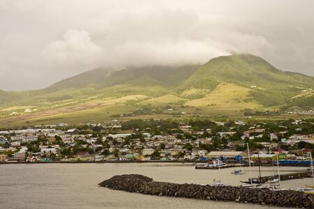 Rain clouds hovering over the coast of a tropical islandの写真素材