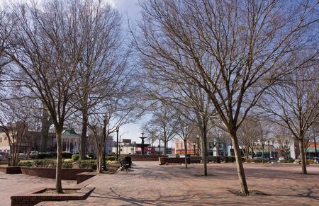 An old fashioned town square with new bricks being installed in the winterの写真素材